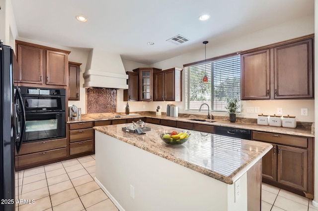 1710 S Parkcrest St, Gilbert, AZ 85295 - kitchen with a sink, custom range hood, light tile patterned floors, black appliances, and a kitchen island