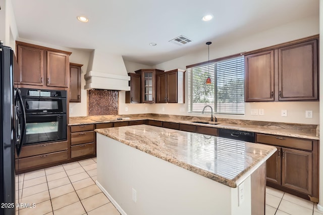 1710 S Parkcrest St, Gilbert, AZ 85295 - kitchen featuring custom range hood, a sink, light tile patterned floors, black appliances, and light stone countertops