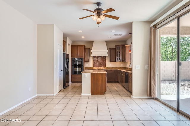 1710 S Parkcrest St, Gilbert, AZ 85295 - kitchen with black appliances, custom exhaust hood, ceiling fan, backsplash, and a center island