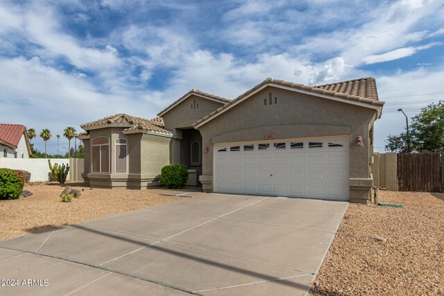 view of front of property with a garage