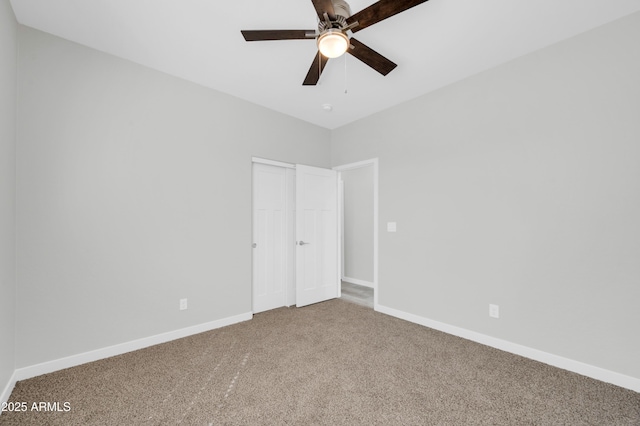 unfurnished bedroom with a ceiling fan, carpet, baseboards, and a closet