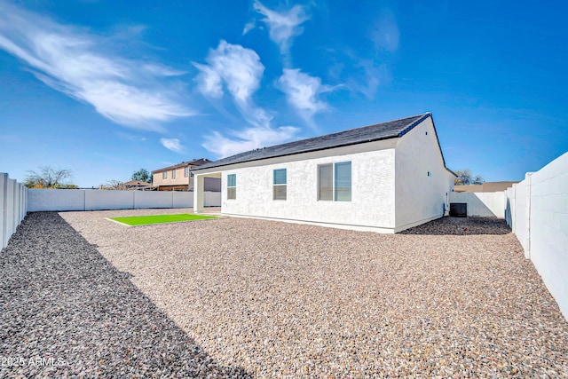 back of house featuring stucco siding, central air condition unit, a fenced backyard, and a patio area