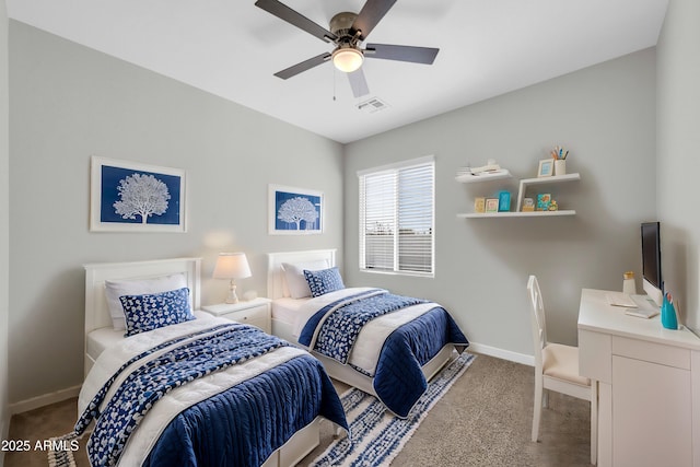 carpeted bedroom with visible vents, a ceiling fan, and baseboards