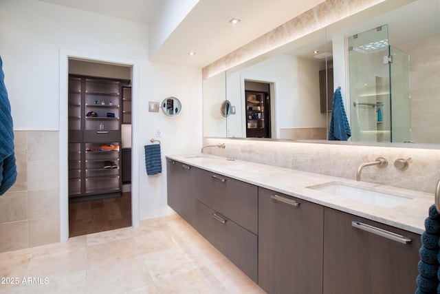 bathroom with vanity, tile walls, and tile patterned floors