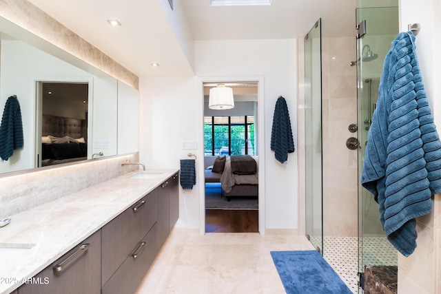 bathroom featuring vanity, tile patterned floors, and walk in shower