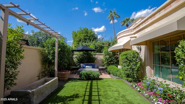 view of yard with a pergola, an outdoor hangout area, and a patio area