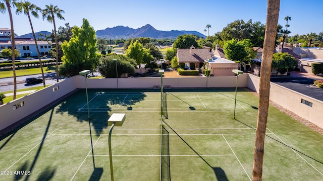 view of sport court with a mountain view