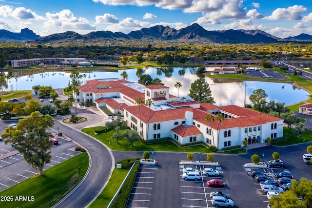 drone / aerial view with a water and mountain view