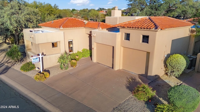 7500 E Boulders Pkwy Unit 39, Scottsdale, AZ 85266 - view of front of home with a tile roof, driveway, and stucco siding