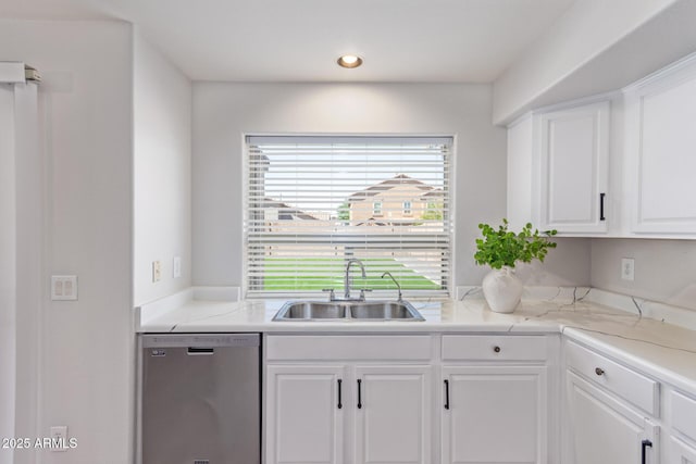 kitchen featuring white cabinets, recessed lighting, light countertops, dishwasher, and a sink