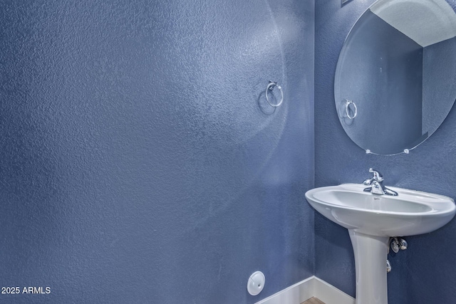 bathroom featuring baseboards