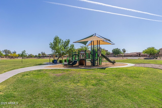 community play area featuring a lawn