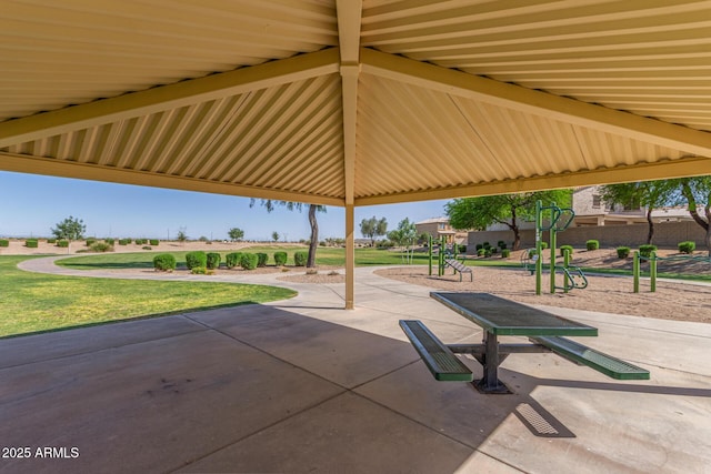 surrounding community with a patio area, a lawn, and playground community
