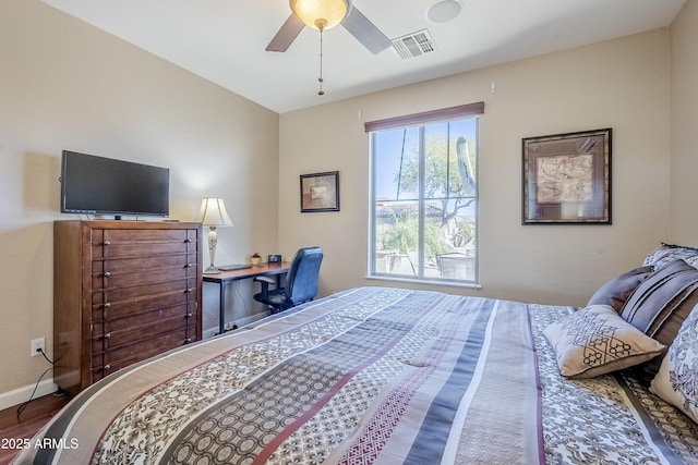 bedroom featuring ceiling fan and hardwood / wood-style flooring