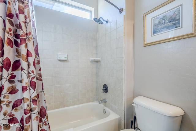 bathroom featuring toilet and shower / tub combo