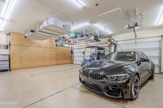 garage featuring a garage door opener