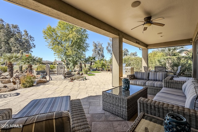 view of patio / terrace featuring ceiling fan and an outdoor living space