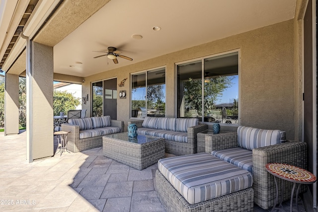 view of patio with ceiling fan and an outdoor living space