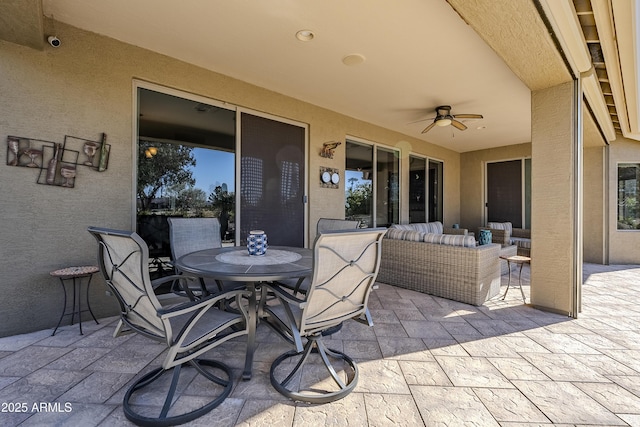 view of patio / terrace with ceiling fan and outdoor lounge area