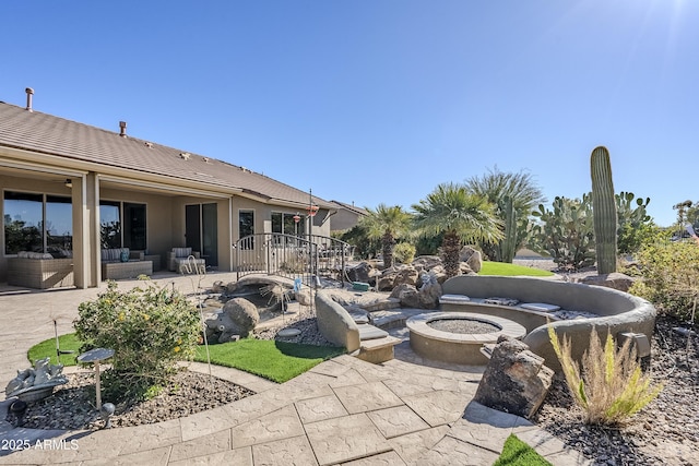 view of patio / terrace with a fire pit