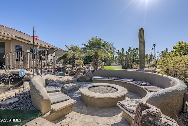 view of patio / terrace with an outdoor fire pit