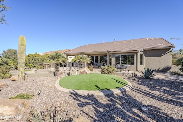 rear view of property featuring a patio area