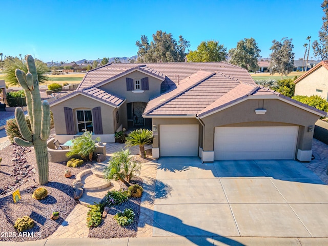 view of front of home with a garage