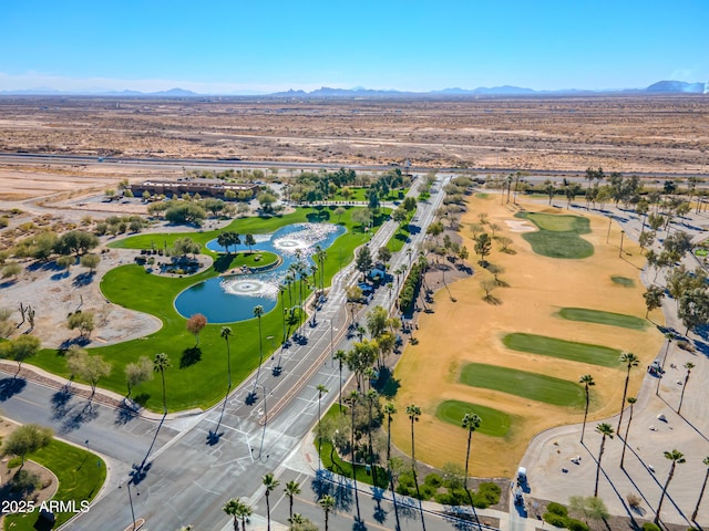 drone / aerial view with a water and mountain view