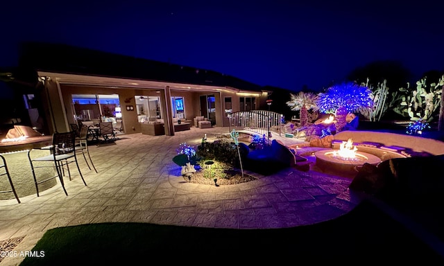 exterior space featuring a patio area and an outdoor fire pit