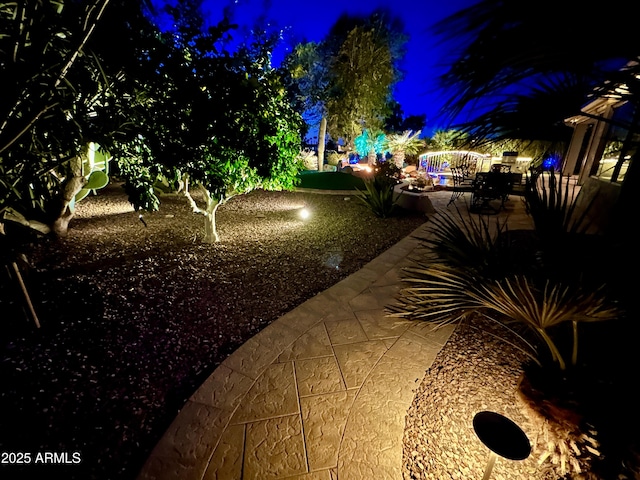 view of yard at twilight