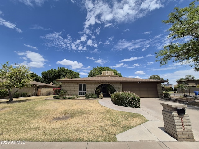 1118 E Orangewood Ave, Phoenix, AZ 85020 - single story home with an attached garage, brick siding, a front yard, and driveway