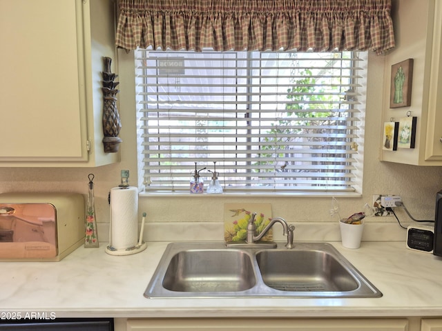 1118 E Orangewood Ave, Phoenix, AZ 85020 - kitchen featuring a sink, light countertops, and plenty of natural light