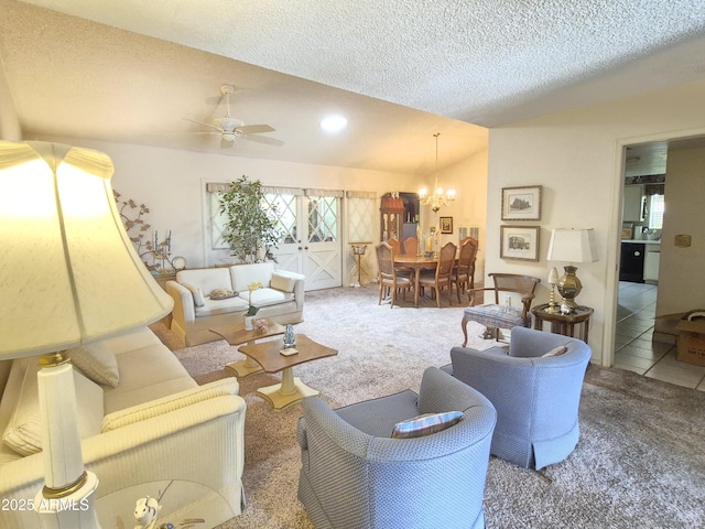 1118 E Orangewood Ave, Phoenix, AZ 85020 - living area featuring lofted ceiling, carpet floors, a ceiling fan, a chandelier, and a textured ceiling