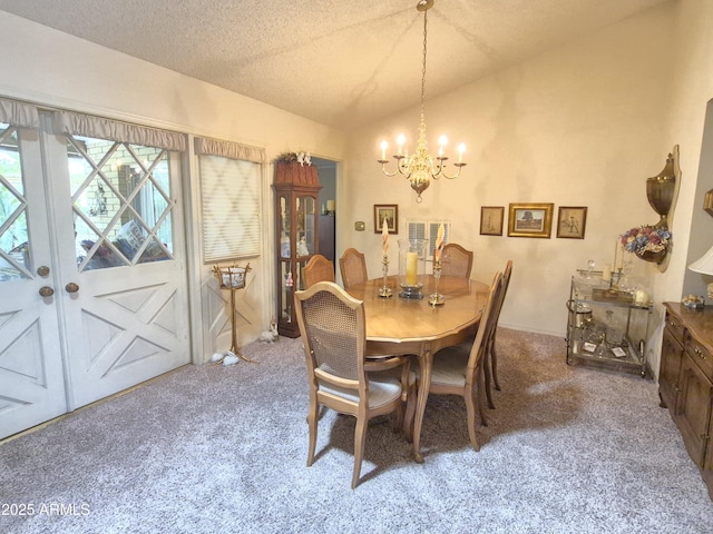 1118 E Orangewood Ave, Phoenix, AZ 85020 - dining space with carpet, lofted ceiling, a chandelier, and a textured ceiling