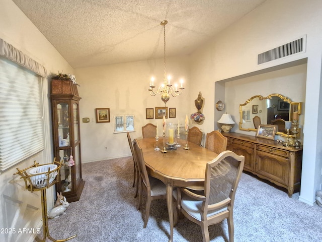 1118 E Orangewood Ave, Phoenix, AZ 85020 - dining room with vaulted ceiling, light carpet, a textured ceiling, and a chandelier