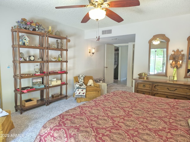 1118 E Orangewood Ave, Phoenix, AZ 85020 - carpeted bedroom featuring a textured ceiling and ceiling fan