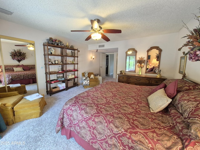 1118 E Orangewood Ave, Phoenix, AZ 85020 - carpeted bedroom with a textured ceiling and a ceiling fan