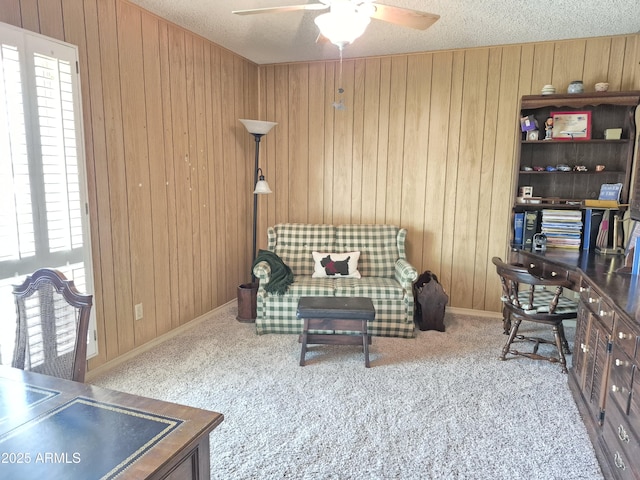 1118 E Orangewood Ave, Phoenix, AZ 85020 - office featuring a ceiling fan, wood walls, carpet flooring, a textured ceiling, and baseboards