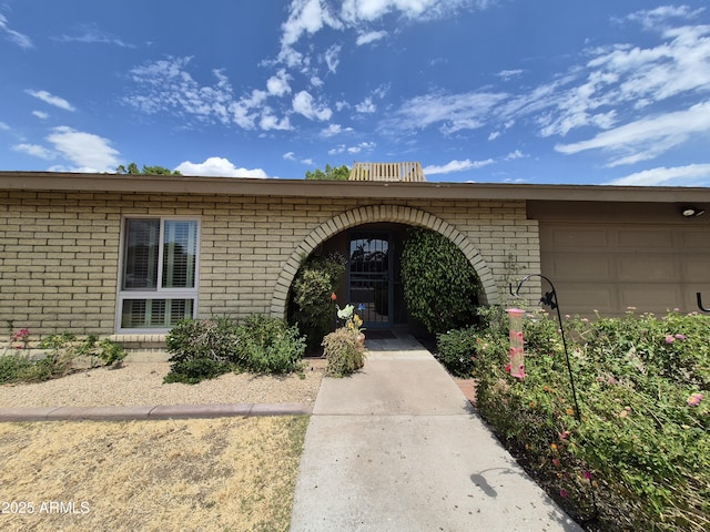 1118 E Orangewood Ave, Phoenix, AZ 85020 - entrance to property featuring brick siding and an attached garage