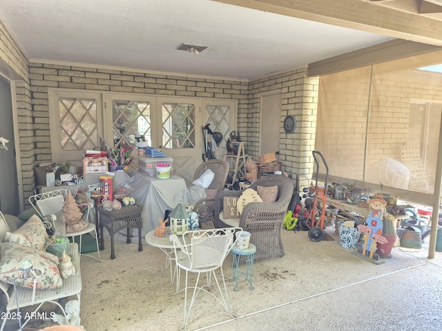 1118 E Orangewood Ave, Phoenix, AZ 85020 - living room featuring brick wall