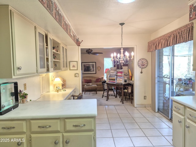 1118 E Orangewood Ave, Phoenix, AZ 85020 - kitchen featuring green cabinetry, light countertops, open floor plan, a chandelier, and ceiling fan