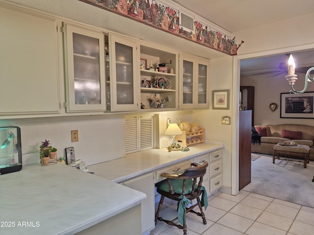 1118 E Orangewood Ave, Phoenix, AZ 85020 - office space featuring built in desk, light tile patterned floors, and light carpet