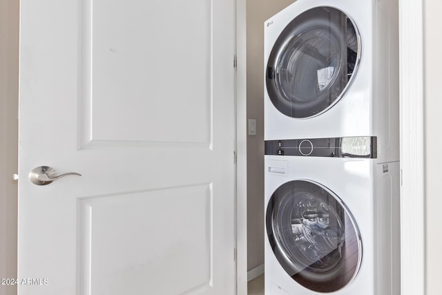 washroom with stacked washer and clothes dryer