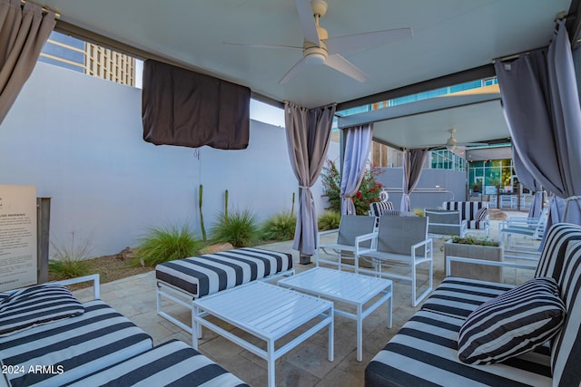 view of patio / terrace with ceiling fan and an outdoor living space