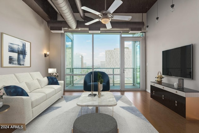 living room featuring hardwood / wood-style flooring and ceiling fan