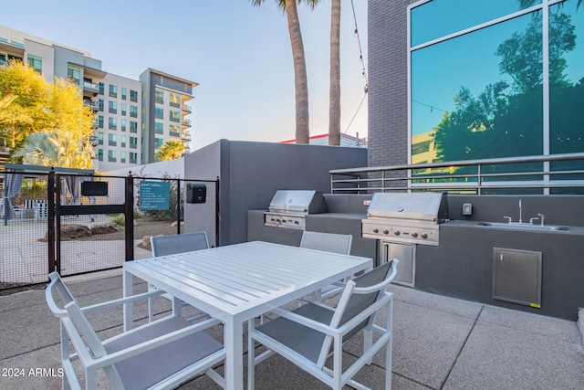 view of patio / terrace with a grill, area for grilling, and sink