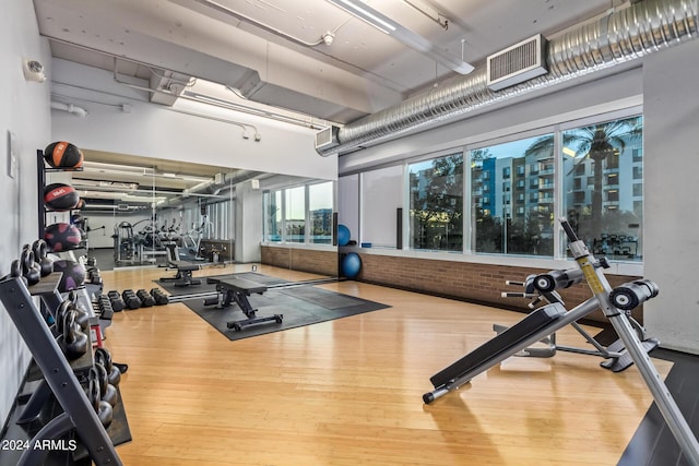 gym with hardwood / wood-style floors