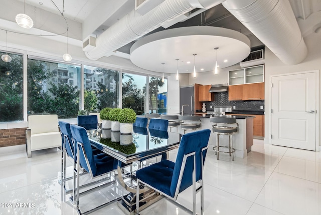 dining area with sink and light tile patterned floors