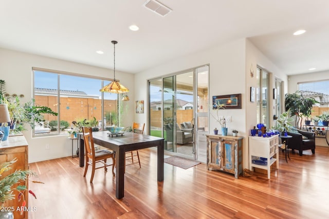 dining room featuring recessed lighting, visible vents, and wood finished floors