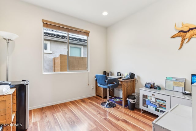 office area with recessed lighting, baseboards, and wood finished floors